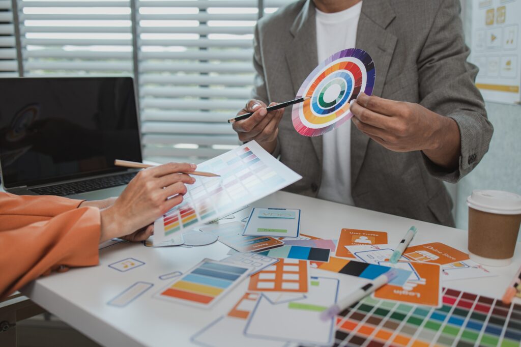 UX graphic designer planning application process development prototype, software development team, copy space, collaboration UX developer and UI designer, team analyzing mobile app interface