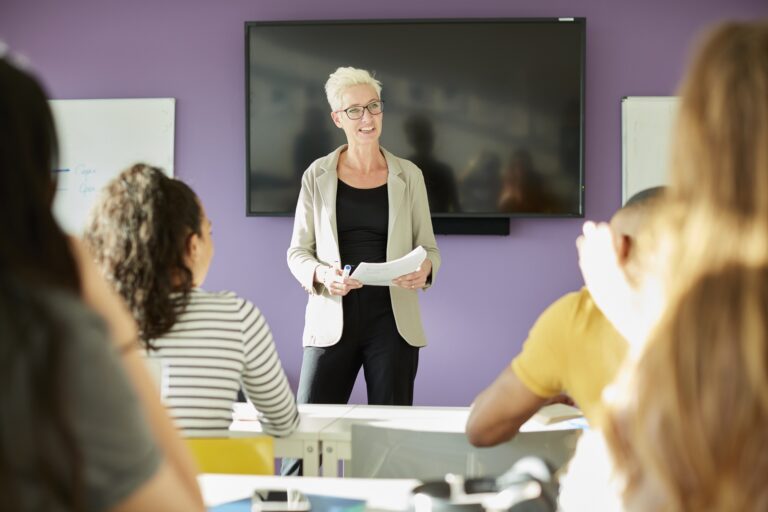 University lecturer and students in class